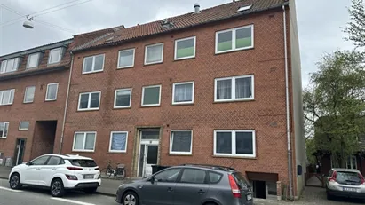 Boligudlejningsejendom med 13 lejemål nær centrum